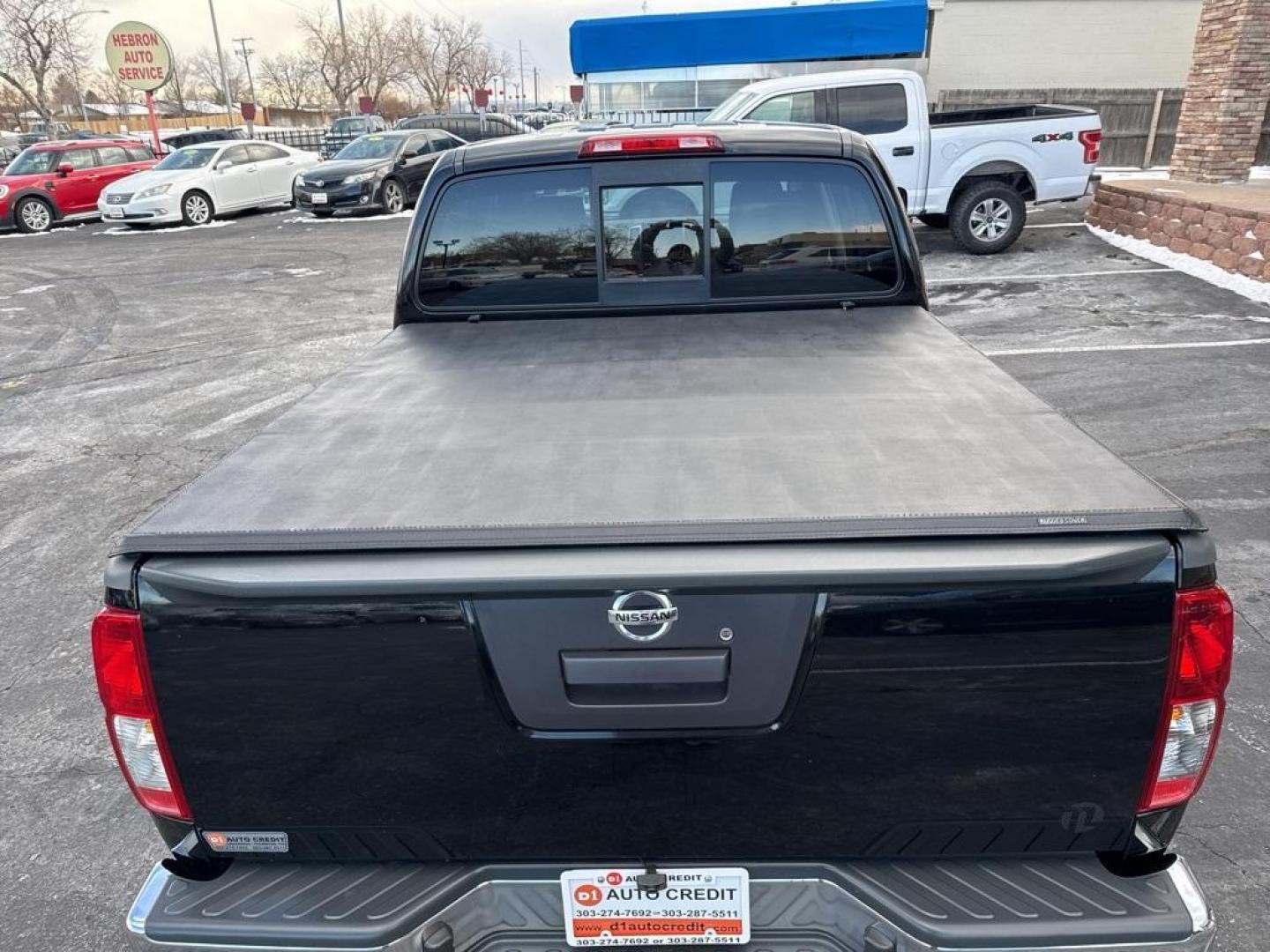 2015 Black /Graphite Nissan Frontier SV (1N6AD0EV5FN) with an 4.0L V6 DOHC engine, Automatic transmission, located at 8595 Washington St., Thornton, CO, 80229, (303) 287-5511, 39.852348, -104.978447 - 2015 Nissan Frontier SV 4WD with clean Carfax, no accidents and fully serviced. This truck is a non smoker, non pet car and has a 2 inch leveling kit and soft tanneau cover. You can tell the previous owner took good care if this one. <br><br>All Cars Have Clean Titles And Are Serviced Before Sale., - Photo#8