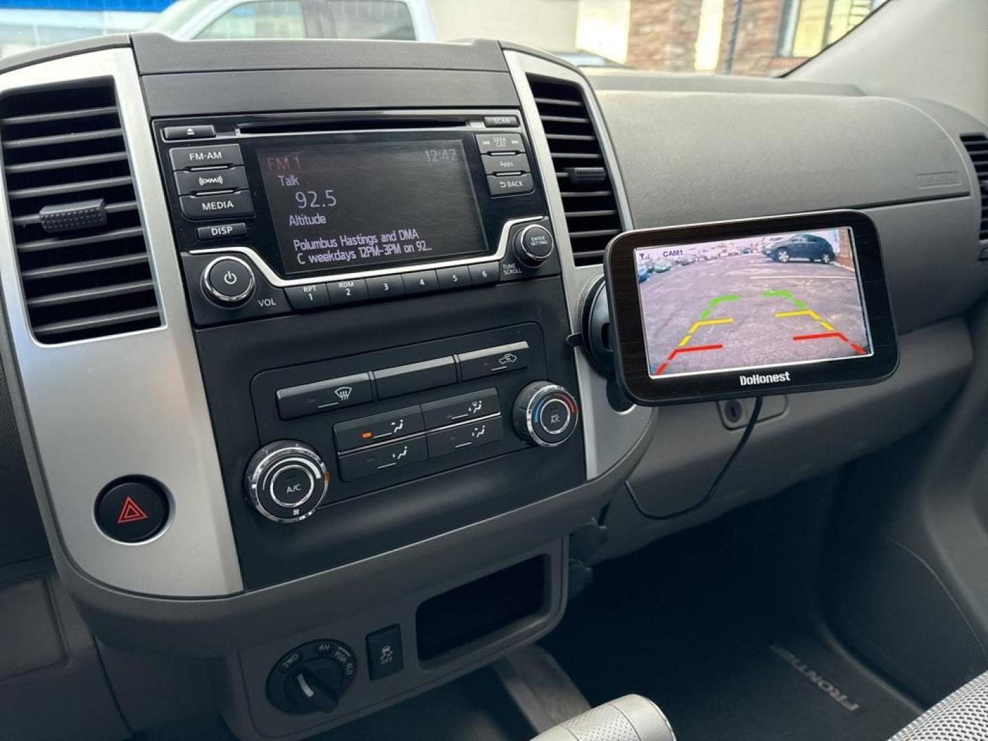 2015 Black /Graphite Nissan Frontier SV (1N6AD0EV5FN) with an 4.0L V6 DOHC engine, Automatic transmission, located at 8595 Washington St., Thornton, CO, 80229, (303) 287-5511, 39.852348, -104.978447 - 2015 Nissan Frontier SV 4WD with clean Carfax, no accidents and fully serviced. This truck is a non smoker, non pet car and has a 2 inch leveling kit and soft tanneau cover. You can tell the previous owner took good care if this one. <br><br>All Cars Have Clean Titles And Are Serviced Before Sale., - Photo#11