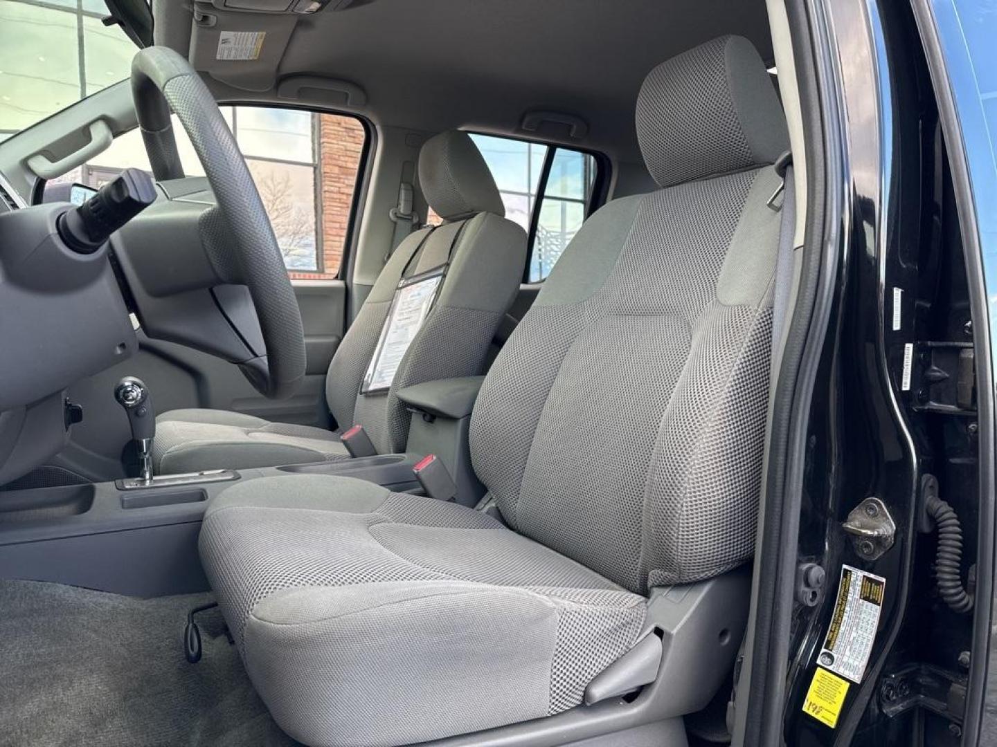 2015 Black /Graphite Nissan Frontier SV (1N6AD0EV5FN) with an 4.0L V6 DOHC engine, Automatic transmission, located at 8595 Washington St., Thornton, CO, 80229, (303) 287-5511, 39.852348, -104.978447 - 2015 Nissan Frontier SV 4WD with clean Carfax, no accidents and fully serviced. This truck is a non smoker, non pet car and has a 2 inch leveling kit and soft tanneau cover. You can tell the previous owner took good care if this one. <br><br>All Cars Have Clean Titles And Are Serviced Before Sale., - Photo#14