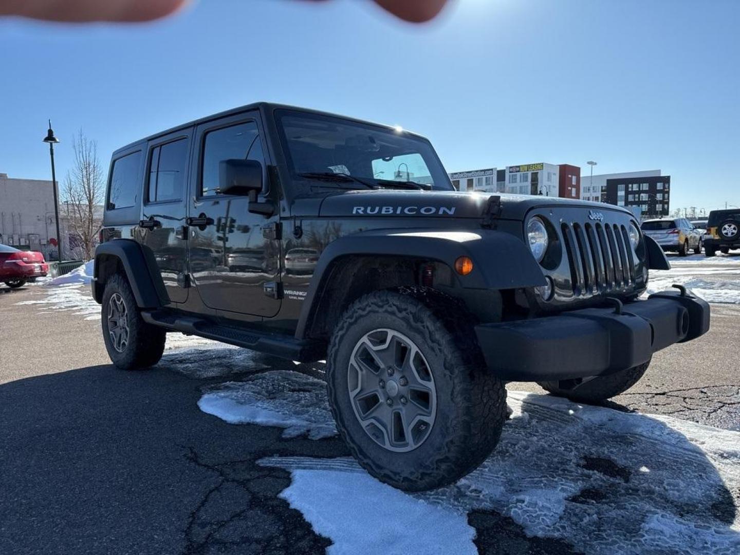 2015 Tank Clearcoat /Black Jeep Wrangler Unlimited Rubicon (1C4BJWFG7FL) with an 3.6L V6 24V VVT engine, Manual transmission, located at 10890 W. Colfax Ave., Lakewood, CO, 80215, (303) 274-7692, 39.739914, -105.120132 - 2015 Jeep Wrangler 4WDD1 Auto NEVER charges dealer fees! All cars have clean titles and have been inspected for mechanical issues. We have financing for everyone. Good credit, bad credit, first time buyers.Clean CARFAX.Please call Lakewood Location 303-274-7692 or Thornton 303-287-5511 to schedule a - Photo#2