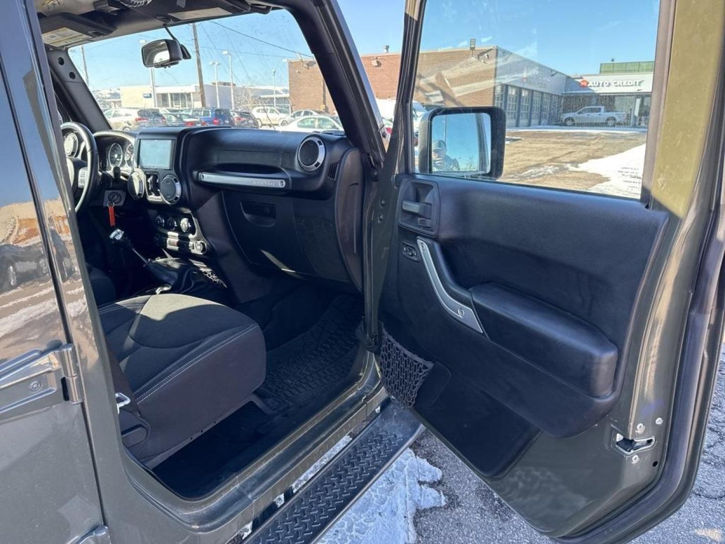 2015 Tank Clearcoat /Black Jeep Wrangler Unlimited Rubicon (1C4BJWFG7FL) with an 3.6L V6 24V VVT engine, Manual transmission, located at 10890 W. Colfax Ave., Lakewood, CO, 80215, (303) 274-7692, 39.739914, -105.120132 - 2015 Jeep Wrangler 4WDD1 Auto NEVER charges dealer fees! All cars have clean titles and have been inspected for mechanical issues. We have financing for everyone. Good credit, bad credit, first time buyers.Clean CARFAX.Please call Lakewood Location 303-274-7692 or Thornton 303-287-5511 to schedule a - Photo#8