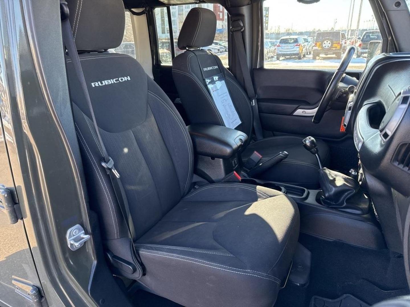 2015 Tank Clearcoat /Black Jeep Wrangler Unlimited Rubicon (1C4BJWFG7FL) with an 3.6L V6 24V VVT engine, Manual transmission, located at 10890 W. Colfax Ave., Lakewood, CO, 80215, (303) 274-7692, 39.739914, -105.120132 - 2015 Jeep Wrangler 4WDD1 Auto NEVER charges dealer fees! All cars have clean titles and have been inspected for mechanical issues. We have financing for everyone. Good credit, bad credit, first time buyers.Clean CARFAX.Please call Lakewood Location 303-274-7692 or Thornton 303-287-5511 to schedule a - Photo#9