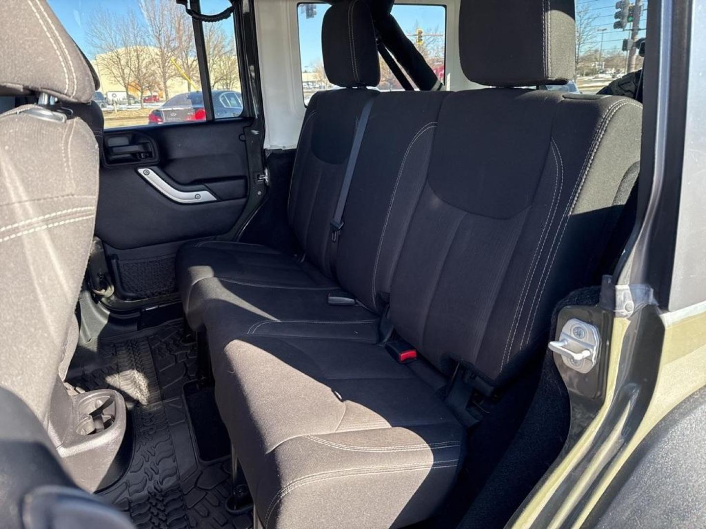 2015 Tank Clearcoat /Black Jeep Wrangler Unlimited Rubicon (1C4BJWFG7FL) with an 3.6L V6 24V VVT engine, Manual transmission, located at 10890 W. Colfax Ave., Lakewood, CO, 80215, (303) 274-7692, 39.739914, -105.120132 - 2015 Jeep Wrangler 4WDD1 Auto NEVER charges dealer fees! All cars have clean titles and have been inspected for mechanical issues. We have financing for everyone. Good credit, bad credit, first time buyers.Clean CARFAX.Please call Lakewood Location 303-274-7692 or Thornton 303-287-5511 to schedule a - Photo#12